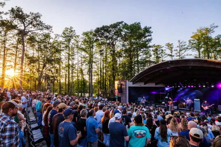 Evening concert beneath the cypress trees at Greenfield Lake Amphitheater